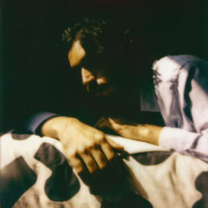 image of a self portrait of Hamza Ashraf. The image is high contrast and shot on film.