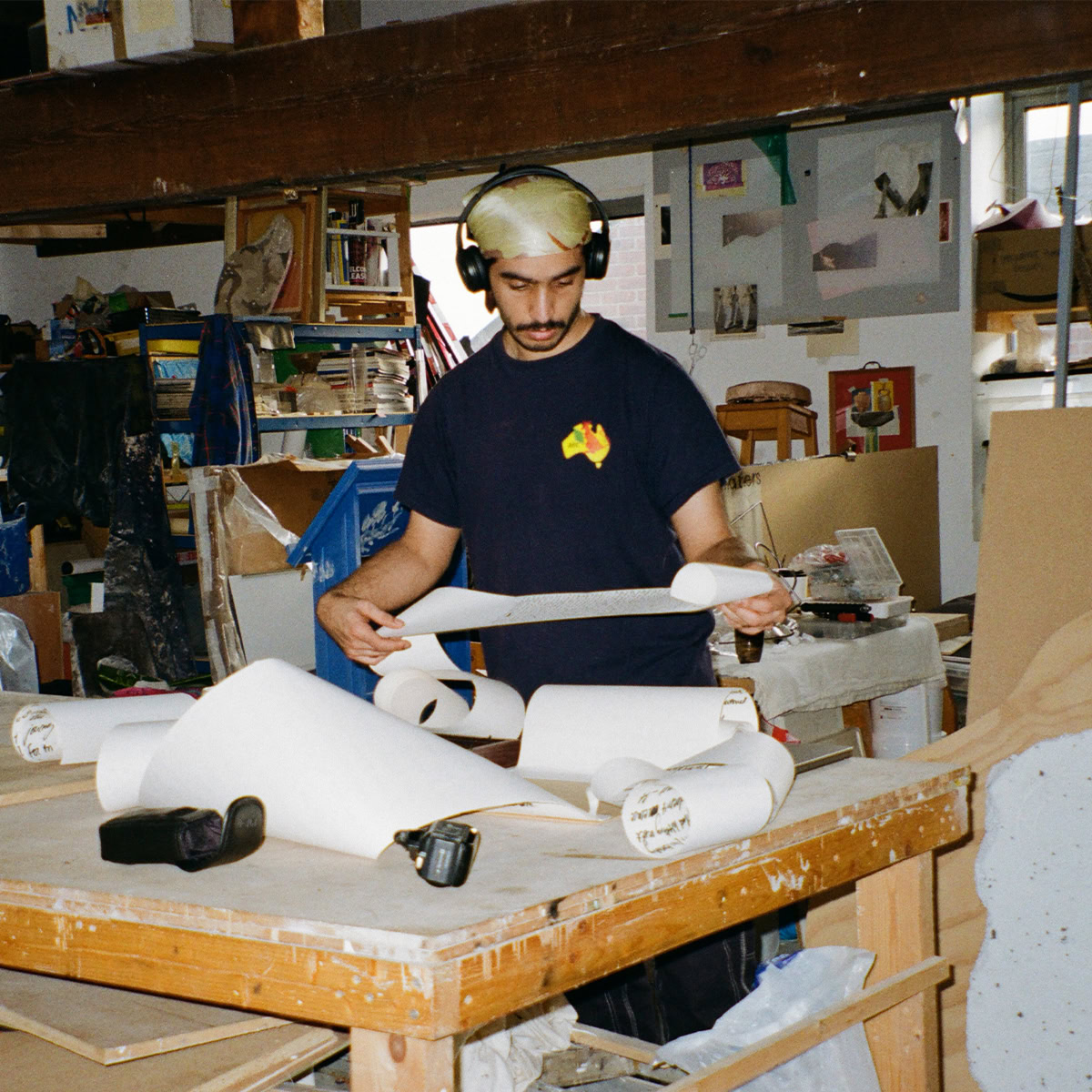 Film image of Hamza Ashraf in the studio producing some new work.