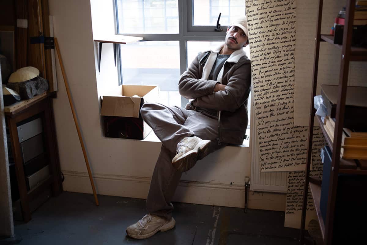 Hamza, Sat on a window sill. Leaning against his most recent body of work